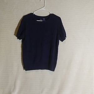 Sweater with braided design.